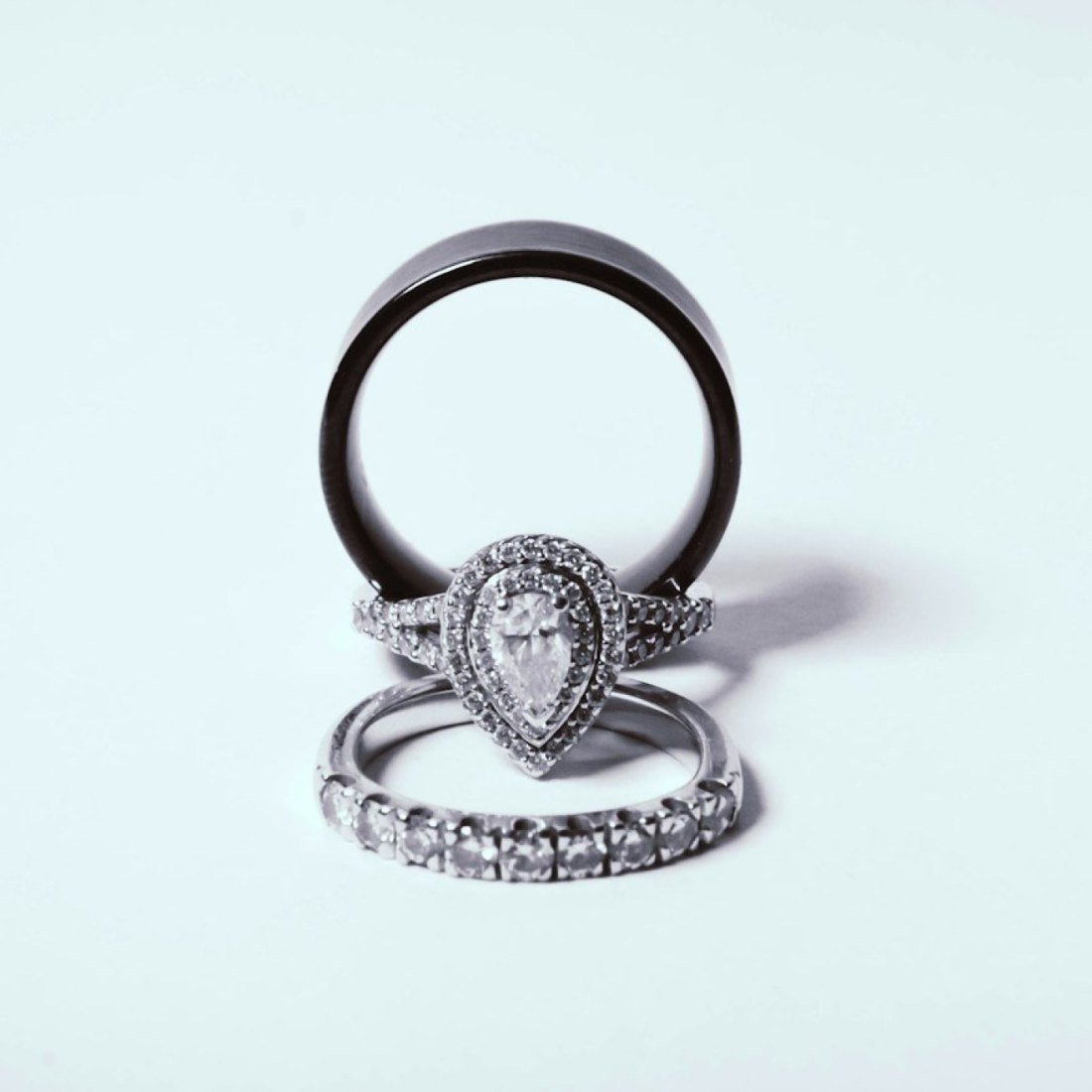 A pair of rings standing upright on a bare tabletop